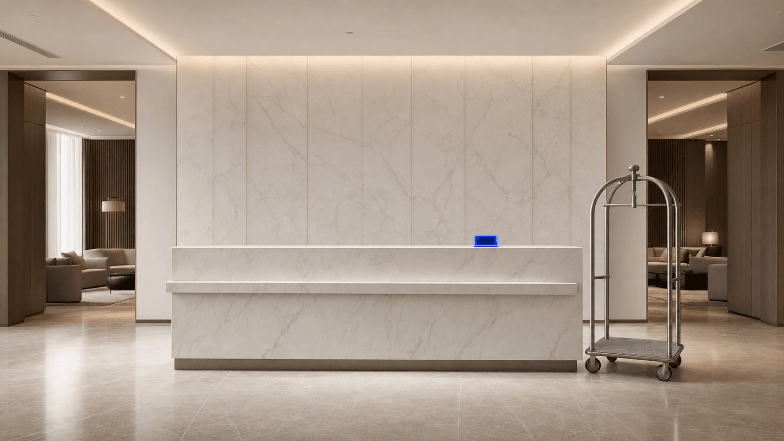 A marble hotel reception desk with a bellhop luggage cart, a cobalt-lit tablet accent on the counter